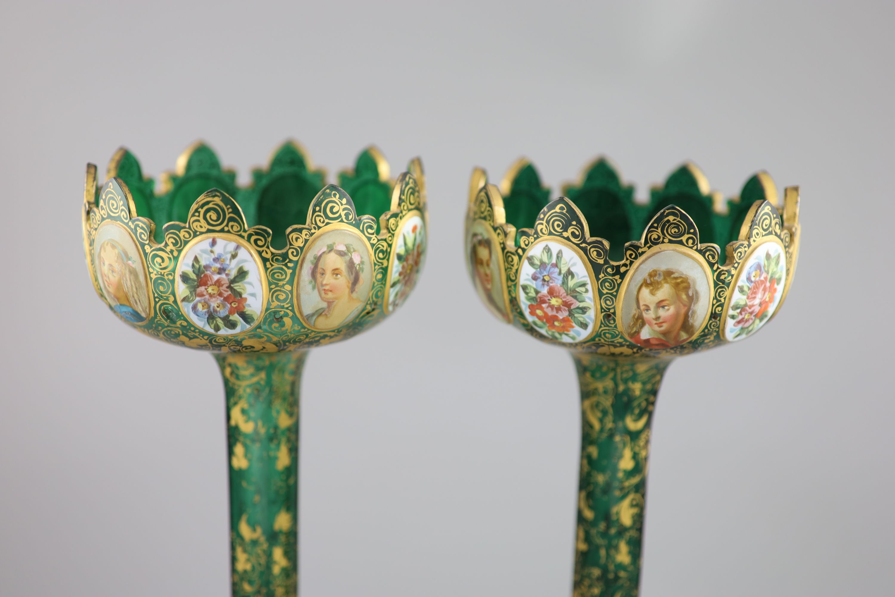 A pair of Bohemian enamelled white overlaid green glass vases, late 19th century, 31cm high